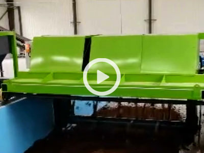 Trough-type composting machine in operation
