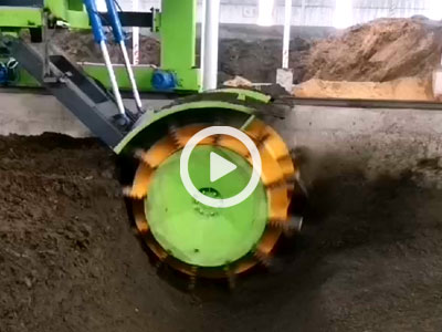 Wheel-type compost turning machine in operation