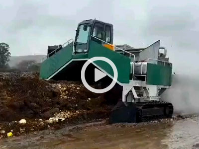 Tracked compost turning machine in operation.